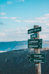 Directional sign at the top of Lyderhorn Mountain, Bergen, Norway
