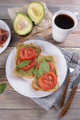 Sticker - Breakfast with fried eggs and bacon and sandwiches with guacamole sauce