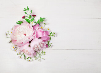 Poster - Bouquet of beautiful flowers on white wooden background. Top view. Copy space