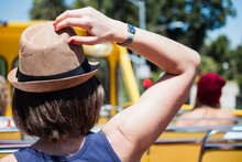 Female Tourist Wearing A Hat On A Open Top Bus In LA