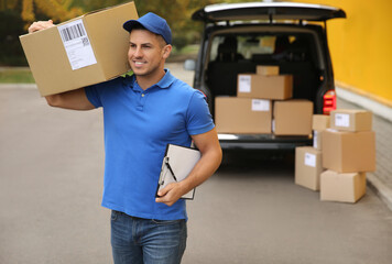 Poster - Courier with clipboard and parcel near delivery van outdoors. Space for text