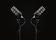 © David Peperkamp - Two Podcast microphones on a tripod, a black metal dynamic microphone, isolated black background, recording podcast or radio program, show, sound and audio equipment, technology, product photo, dj