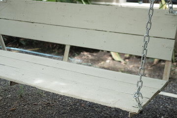 Wall Mural - Wooden white swing in garden