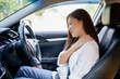 © PBXStudio - Asian business woman has shoulder and neck pain in the car