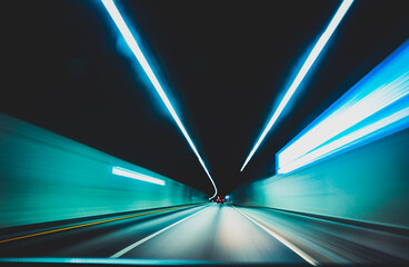 blurred modern underground tunnel in long exposure showing speed