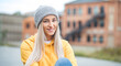 © Alen-D - Smiling young beautiful woman looking at camera. Copy space. Outdoors daylight. Half length of pretty girl with positive emotion, smiley expression. Female person wearing casual clothing