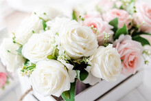 Bouquet Of Artificial Peonies And Roses On A Light Wooden Background