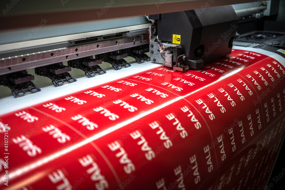 Full-color printing on the machine of the sticker with the inscription sale - obrazy, fototapety, plakaty 