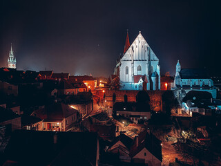 Night Znojmo and its two biggest landmarks - the town hall tower and the church of St. Nicholas.