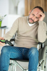 Wall Mural - mature disabled man frustrated by computer game