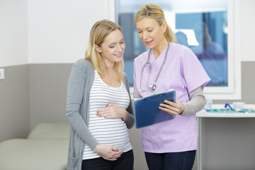 obstetrician gynecologist talking to female patient