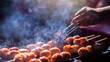 © Koonsiri - Selective focus to grilled sausages on the barbecue grill. Thai style grilled sausage on stove.