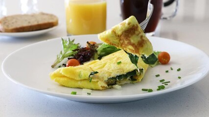 Canvas Print - Eating a Spinach Cheese Omelette