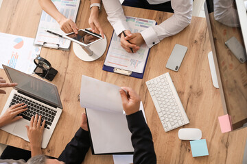 Canvas Print - Team of business people during meeting in office