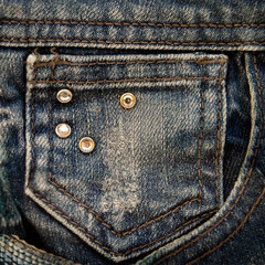 Denim jeans fabric texture background with seam and pocket