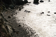High Angle Of Sea Foams On The Rocky Shore