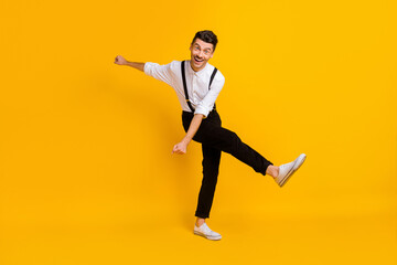 Sticker - Full length body size view of nice skinny cheerful guy dancing having fun isolated over bright yellow color background