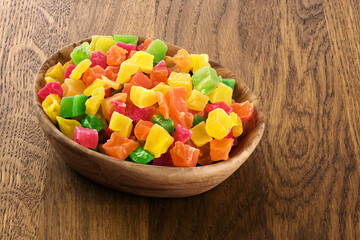 Wall Mural - Candied fruits on wooden background.