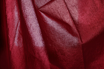 Wall Mural - Fiery red fabric with shadow streaks.