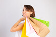 © Анастасия Каргаполов - Studio photo of european woman with shopping bags on white background