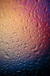 multicolored water drops on glass, gradient