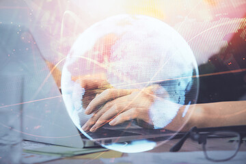 multi exposure of woman hands typing on computer and business theme hologram drawing. success concep