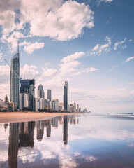 Sticker - vertical shot of a beach in the background of highrise buildings in goldcoast, australia