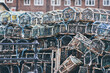 Lobster and crab pots traps stacked on harbour. Fishing industry in Whitby, England, United Kingdom.