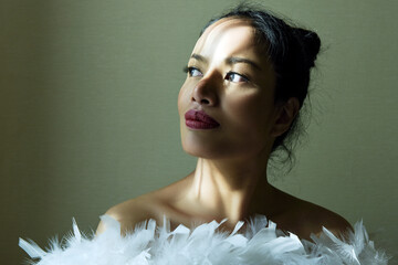 beautiful The beautiful pensive girl in white feathers