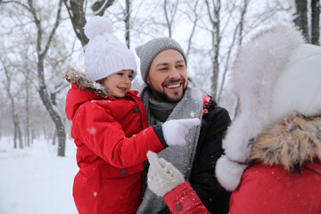 Poster - Family spending time outside on winter day. Christmas vacation