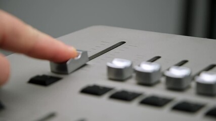 Remote control for adjusting the light. Light mixer. Light engineer adjusts the lighting. Change the light level. Recording studio. Shooting a television show, a concert. Live broadcast.