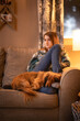 © Brandy - Girl relaxing with her dog dachshund