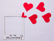 concept love picture frame with words be my valentine with red hearts coming out flat lay on white background