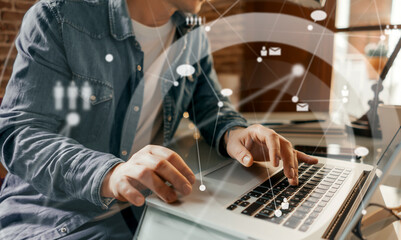 Male hands with laptop. Man working remotely at home. Concept of networking or remote work. Global business network.