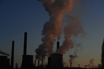 The chimney of a thermal power plant, the smoke extracted by a thermal power plant on the chimney, in the production process. Environment. Pollution.
