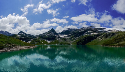 water reservoir with wonderful green blue water in a glacier world panorama