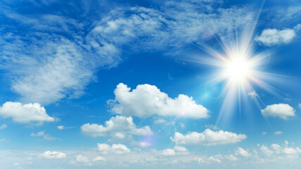 Wall Mural - sunny background, blue sky with white clouds and sun