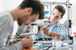 © StockPhotoPro - Engineering students working in the lab