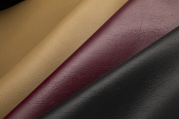 Closeup of rows of colorful luxurious and expensive leather texture