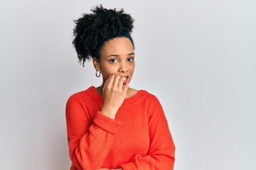 Canvas Print - Young african american girl wearing casual clothes looking stressed and nervous with hands on mouth biting nails. anxiety problem.