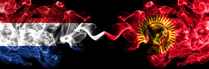 Netherlands vs Kyrgyzstan smoky mystic flags placed side by side. Thick colored silky abstract smoke flags.