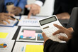 © kamiphotos - Close-up: Businessmen are pressing a calculator in a conference room where entrepreneurs and partners are meeting together, meeting summaries and brainstorming to help the company grow. Concept of bus