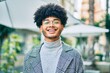 © Krakenimages.com - Young african american businessman smiling happy standing at the city.