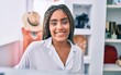 © Krakenimages.com - Young african american woman smiling happy at retail shop