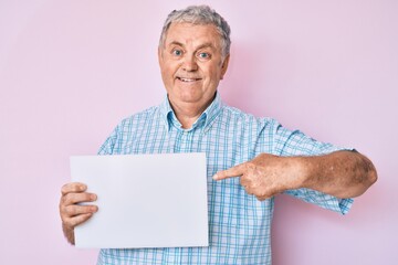 Sticker - Senior grey-haired man holding blank empty banner smiling with a happy and cool smile on face. showing teeth.