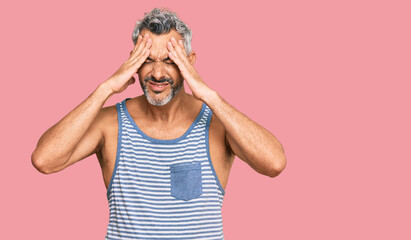 Sticker - Middle age grey-haired man wearing casual style with sleeveless shirt suffering from headache desperate and stressed because pain and migraine. hands on head.