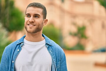 Sticker - Young caucasian man smiling happy standing at the city.