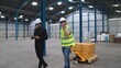 Factory workers deliver boxes package on a pushing trolley in the warehouse . Industry supply chain management concept .