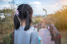 Little Girl Look Thai Naga Statue In The Phu Manorom View