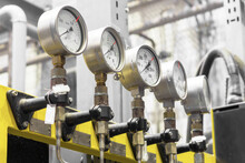 Pressure Gauges Stand In A Row